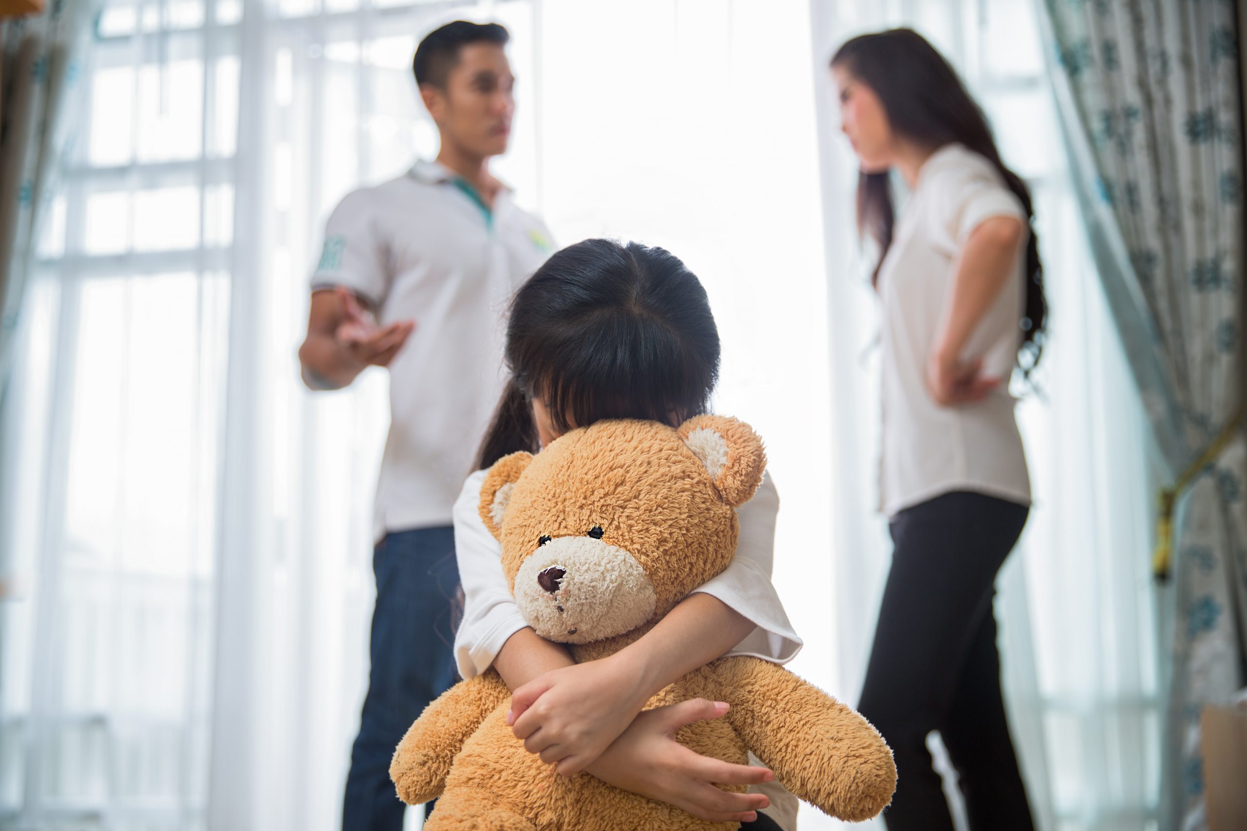 Sad Child with Teddy Bear